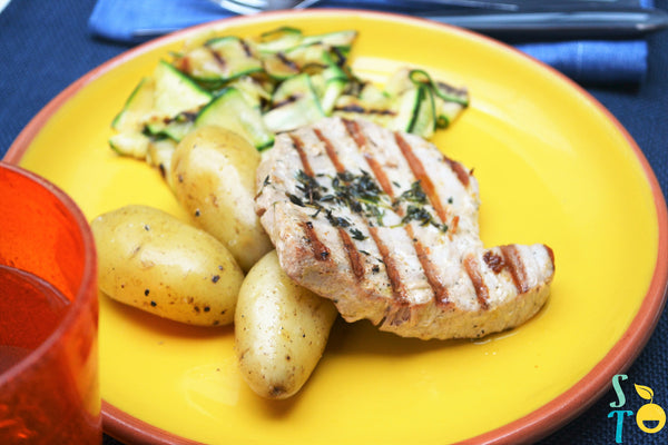 Grilled tuna steaks with courgettes & potatoes